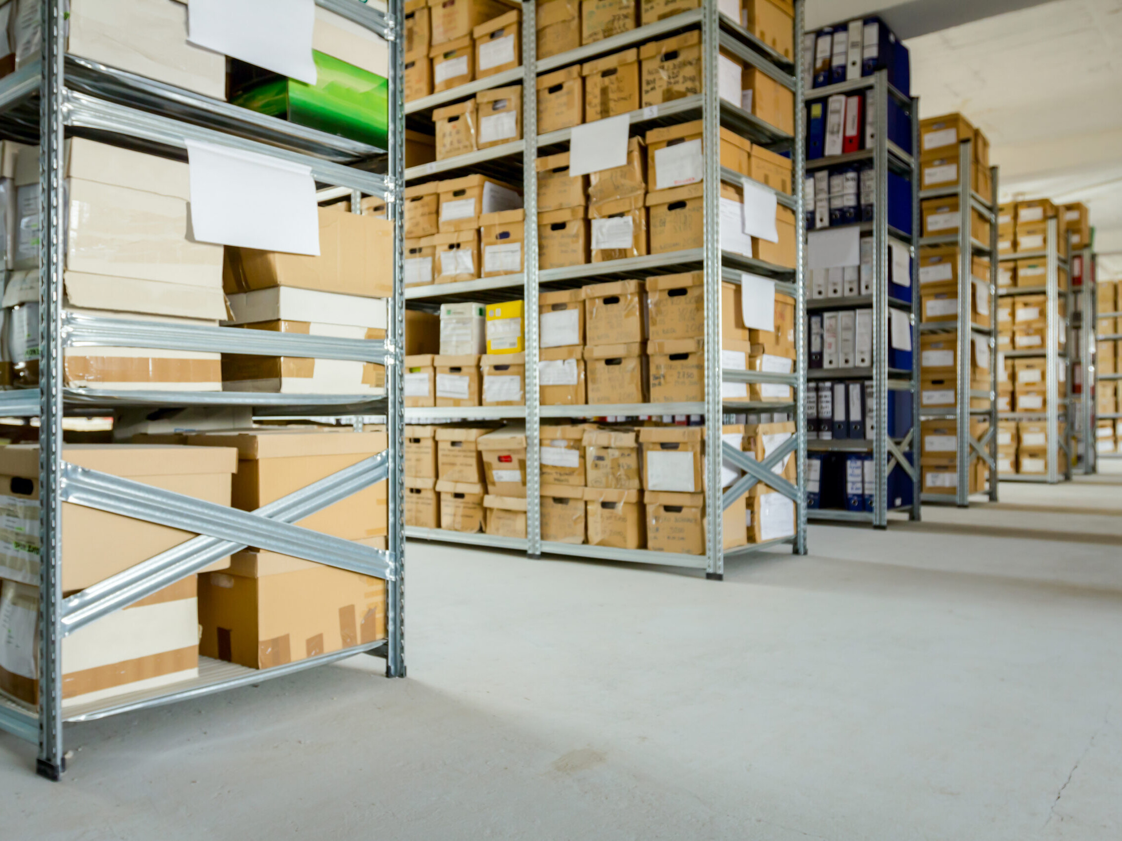 photo of numerous shelves filled with old boxes